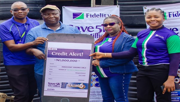 L – R: Direct Sales Executive, Fidelity Bank Plc, Adegboyega Ademokunwa; GAIM 6 Eight Monthly draw winner, Innocent Okoro Orji; Branch Leader, Fidelity Bank Plc, Gbagada, Chinwe Umez-Eronini; and Product Manager, Savings, Fidelity Bank Plc, at the GAIM 6 prize presentation ceremony at Gbagada Building Materials market in Lagos recently. Photo: Fidelity Bank