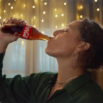 Coca-Cola branding displayed alongside discussions about Studio.One, WPP Open X, and the changing dynamics of global advertising agency relationships.